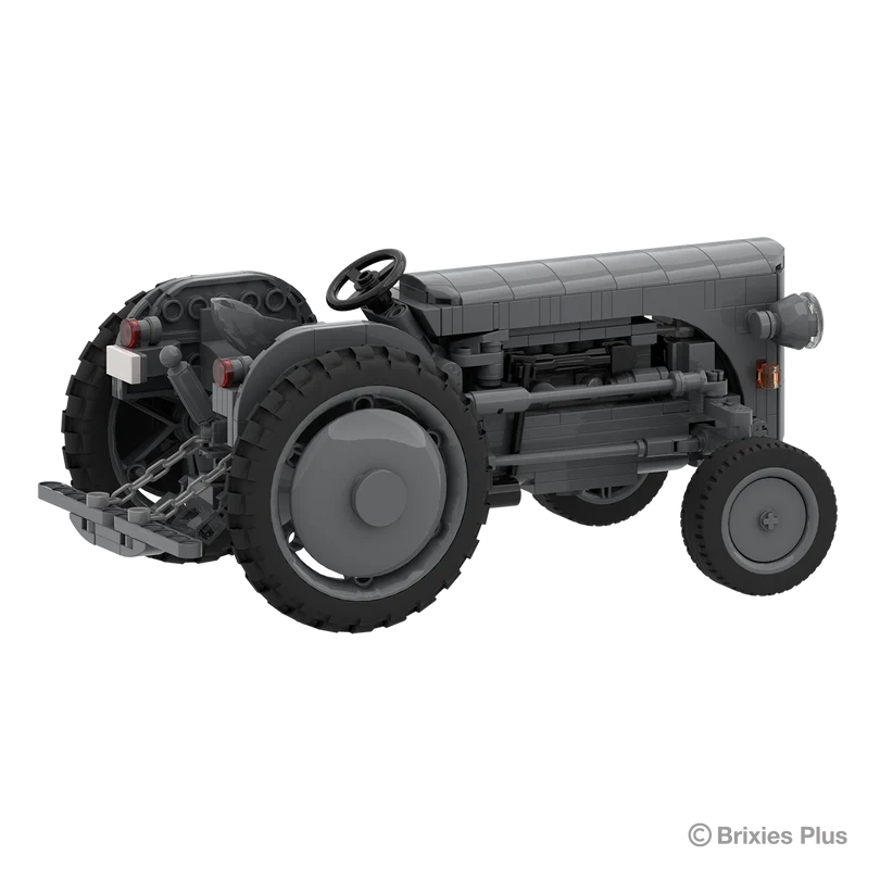 Rear angled view of the BRIXIES Plus Massey Ferguson TEA 20 showing the rear linkage, steering wheel, seat, large rear tyre and exposed side engine details