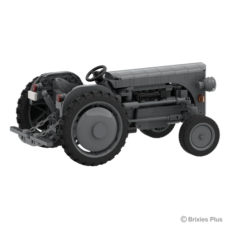 Rear angled view of the BRIXIES Plus Massey Ferguson TEA 20 showing the rear linkage, steering wheel, seat, large rear tyre and exposed side engine details