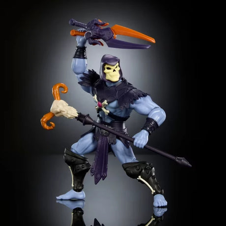 Masters of the Universe Skeletor action figure holding crossed swords above his head and staff in hand
