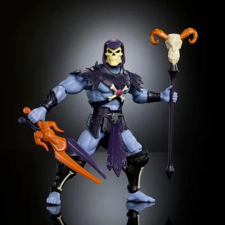 Masters of the Universe Skeletor action figure posed with ram headed staff and two swords