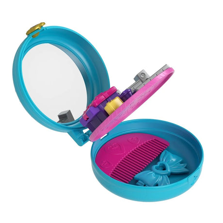 Interior detail of Polly Pocket birthday compact showing comb and bow compartment – Ireland