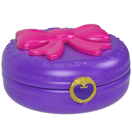 Closed purple Polly Pocket compact with pink bow and heart clasp – Ireland