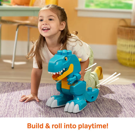 MEGA BLOKS Build & Chomp Dinosaur blue block model on a rug beside a smiling child.