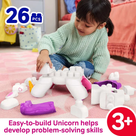 Child building the MEGA BLOKS unicorn with large white, pink and purple blocks