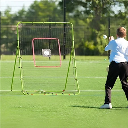 Mega rebounder hurling skills net set up on an outdoor pitch, showing a sliotar rebounding off the mesh within the target zone