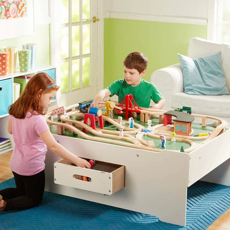 Melissa & Doug Deluxe Wooden Multi-Activity Play Table with open drawer and wooden train layout
