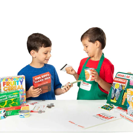 Two children playing with Melissa and Doug Fresh Mart play money and items – Ireland