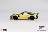 Side profile of Mini GT Nissan Z VeilSide FFZ400 Gold Chrome showing reflective gold bodywork, black roof, five spoke wheels, widened arches and rear spoiler