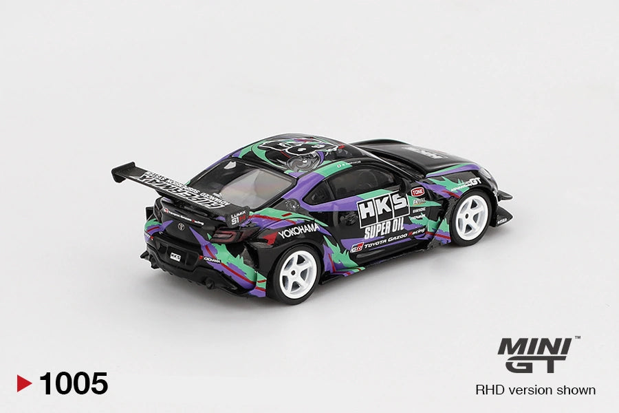 Rear three quarter view of Mini GT Toyota GR86 HKS Type R showing the large rear wing, black rear diffuser, white racing wheels, colourful side graphics and illustrated roof