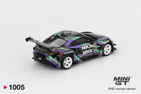 Rear three quarter view of Mini GT Toyota GR86 HKS Type R showing the large rear wing, black rear diffuser, white racing wheels, colourful side graphics and illustrated roof