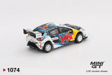 Rear three quarter view of Mini GT Ford Puma Rally1 No.16 showing the large white rear wing, rear diffuser, Red Bull side graphics, white rally wheels and number 16 crew markings