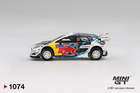 Side profile of Mini GT Ford Puma Rally1 No.16 showing Red Bull graphics, yellow front bodywork, white rally wheels, Castrol branding and Fourmaux and Coria names on the side window