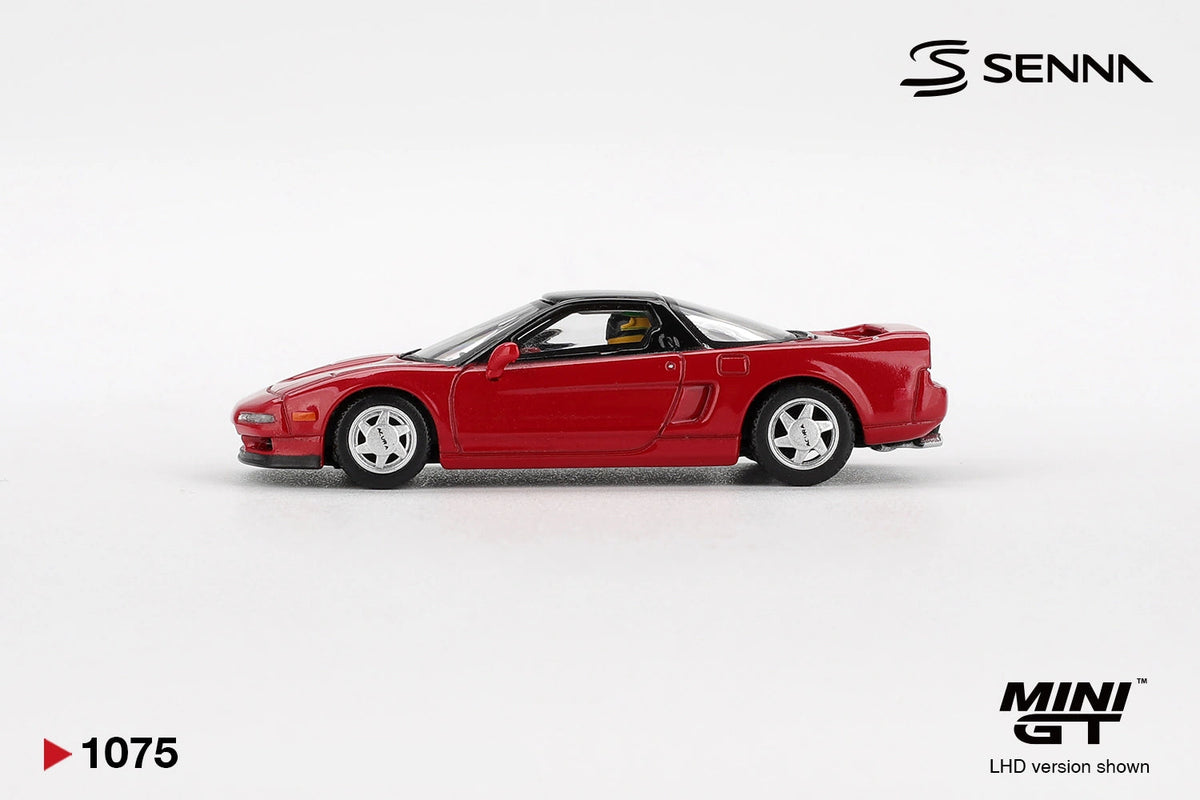 Side profile of Mini GT Honda NS-X 1989 Ayrton Senna showing red bodywork, black roof, silver five spoke wheels, side air intake and helmeted driver figure inside