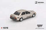 Rear three quarter view of Mini GT Mercedes-Benz 190 E 2.3-16 No.11 Ayrton Senna showing the rear spoiler, rectangular taillights, race number 11, SENNA side graphics and silver wheels