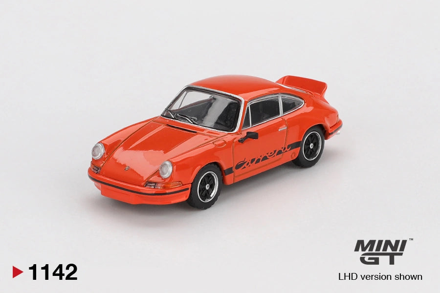 Front three quarter view of Mini GT Porsche 911 Carrera RS 2.7 in Tangerine orange, showing round headlights, black front bumper trim, Carrera side graphics, black wheels and ducktail spoiler. LHD version shown.