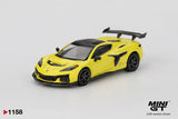 Front three quarter view of Mini GT Chevrolet Corvette ZR1 Accelerate Yellow LHD showing the vented bonnet, angular headlights, black front splitter, side air intake, black wheels and rear wing.