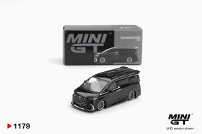 Mini GT Toyota Alphard 40 KUHL Black diecast model with lowered bodywork, silver multi spoke wheels and large front grille, displayed in front of its MINI GT collector box. LHD version shown.