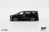 Side profile of Mini GT Toyota Alphard 40 KUHL Black RHD showing lowered black bodywork, silver multi spoke wheels, sliding door handles, tinted windows and rear roof spoiler.
