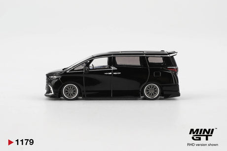 Side profile of Mini GT Toyota Alphard 40 KUHL Black RHD showing lowered black bodywork, silver multi spoke wheels, sliding door handles, tinted windows and rear roof spoiler.