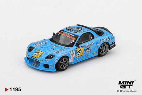 Mini GT Mazda RX-7 RE-Amemiya 2025 D1GP RHD blue diecast car viewed from the front, showing the vented bonnet, number 7 racing graphics, front splitter and silver wheels