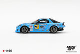 Side profile of Mini GT Mazda RX-7 RE-Amemiya 2025 D1GP RHD showing blue racing bodywork, number 7 door graphics, SHIBATIRE Motorsport branding, silver wheels and sponsor decals