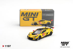 Mini GT Chevrolet Corvette Z06 GT3.R No.4 Corvette Racing yellow diecast car shown from the front three quarter angle with its illustrated Mini GT collector box behind it
