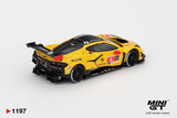 Rear three quarter view of Mini GT Chevrolet Corvette Z06 GT3.R No.4 showing the black rear diffuser, large rear wing, yellow bodywork, racing decals and black wheels