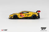 Side profile of Mini GT Chevrolet Corvette Z06 GT3.R No.4 showing yellow racing bodywork, black wheels, red door number 4, Oshkosh and Mobil 1 sponsor graphics