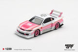 Mini GT Nissan Silvia S15 LB Super Silhouette Amoculture front three quarter view showing the pink bonnet, Liberty Walk windscreen banner, white front splitter, pink wheels and large rear wing