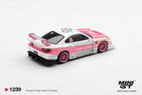 Rear three quarter view of Mini GT Nissan Silvia S15 Amoculture showing pink and white bodywork, pink racing wheels, black rear diffuser, rear lights and large Amoculture rear wing
