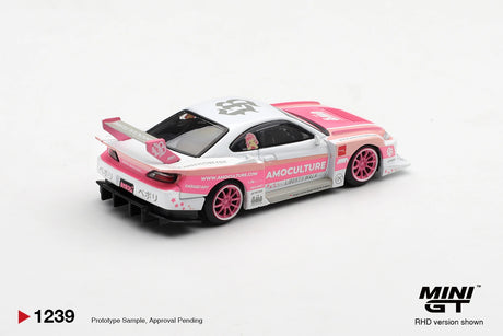 Rear three quarter view of Mini GT Nissan Silvia S15 Amoculture showing pink and white bodywork, pink racing wheels, black rear diffuser, rear lights and large Amoculture rear wing