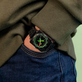 Minecraft Black Time Teacher Watch worn on the wrist showing the black strap and green analogue time teacher dial