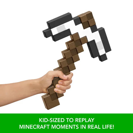 Hand holding the Minecraft Iron Pickaxe toy by its brown pixelated handle