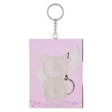 Mini Glam bear shimmer lotion keyring shown attached to pink side packaging