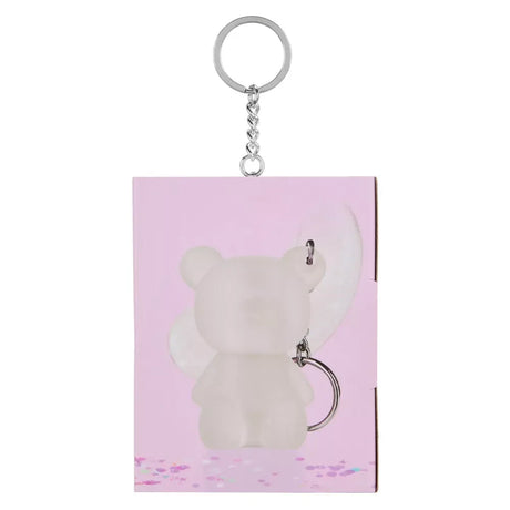 Mini Glam bear shimmer lotion keyring shown attached to pink side packaging
