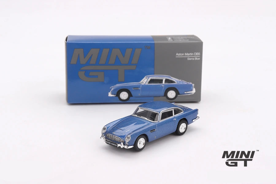 Mini GT Aston Martin DB5 Sierra Blue displayed with its Mini GT box, manufacturer prototype image labelled LHD version shown