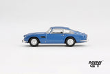 Mini GT Aston Martin DB5 Sierra Blue side profile showing the metallic blue body, chrome trim and wire-style wheels, LHD prototype shown