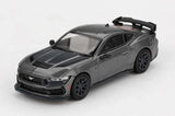 Mini GT Ford Mustang Dark Horse 2024 Carbonized Grey RHD front three-quarter view showing the black bonnet graphics, front splitter and rear wing