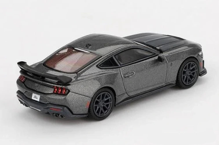 Mini GT Ford Mustang Dark Horse 2024 Carbonized Grey RHD rear three-quarter view showing the rear wing, diffuser and quad exhausts