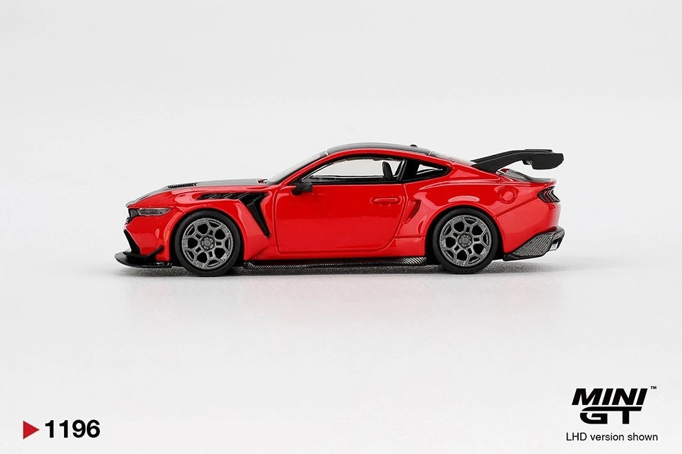 Side profile of Mini GT Ford Mustang GTD Race Red LHD showing the red two-door body, black side vents, silver multi-spoke wheels, rear wing and aerodynamic side skirts.