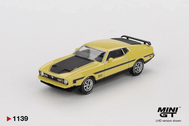 Mini GT Ford Mustang Mach 1 Grabber Yellow LHD front three quarter photograph with black bonnet stripes, chrome wheels, rear spoiler and manufacturer sample markings