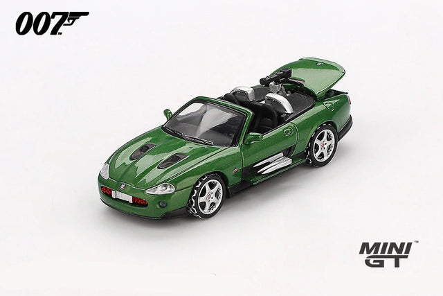 Mini GT James Bond Die Another Day Jaguar XKR green LHD prototype front three quarter view with raised boot lid and rear mounted gun