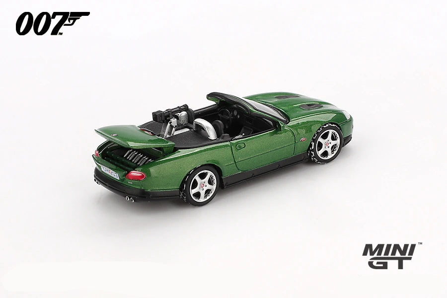 Mini GT James Bond Die Another Day Jaguar XKR green LHD prototype rear three quarter view with raised boot lid and rear mounted gun