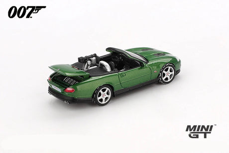 Mini GT James Bond Die Another Day Jaguar XKR green LHD prototype rear three quarter view with raised boot lid and rear mounted gun