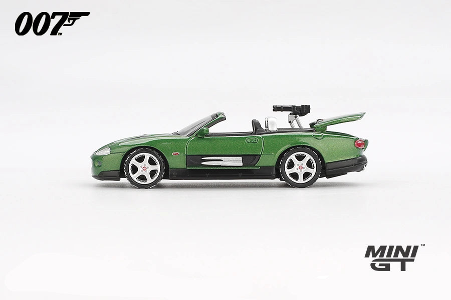 Mini GT James Bond Die Another Day Jaguar XKR green LHD prototype in side profile with raised boot lid and rear mounted gun