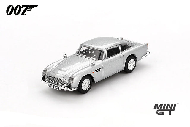 Mini GT James Bond Skyfall Aston Martin DB5 Battle Damaged RHD front three-quarter view showing damaged windows and bullet marks