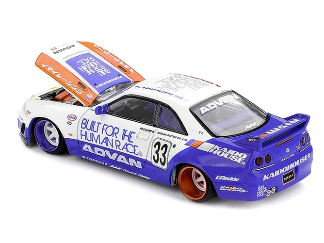 Mini GT x Kaido House Nissan Skyline GT-R R33 BFTHR V1 rear three-quarter view showing the blue rear bodywork, large wing and number 33 graphics