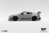 Side profile of Mini GT Nissan LB-Silhouette WORKS GT 35GT-RR Matt Grey RHD showing Liberty Walk graphics, race number 06, black multi-spoke wheels, widened wheel arches and large rear wing.