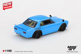 Rear three quarter view of Mini GT Nissan LB Works Hakosuka Baby Blue showing the rear spoiler, rectangular tail lights, wide wheel arches and Liberty Walk graphics