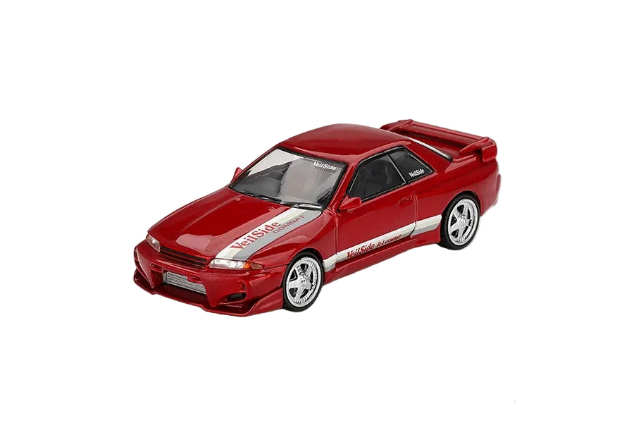 Mini GT Nissan Skyline GT-R R32 VeilSide Combat C-I Gem Red RHD front three-quarter view showing the VeilSide body kit and rear wing